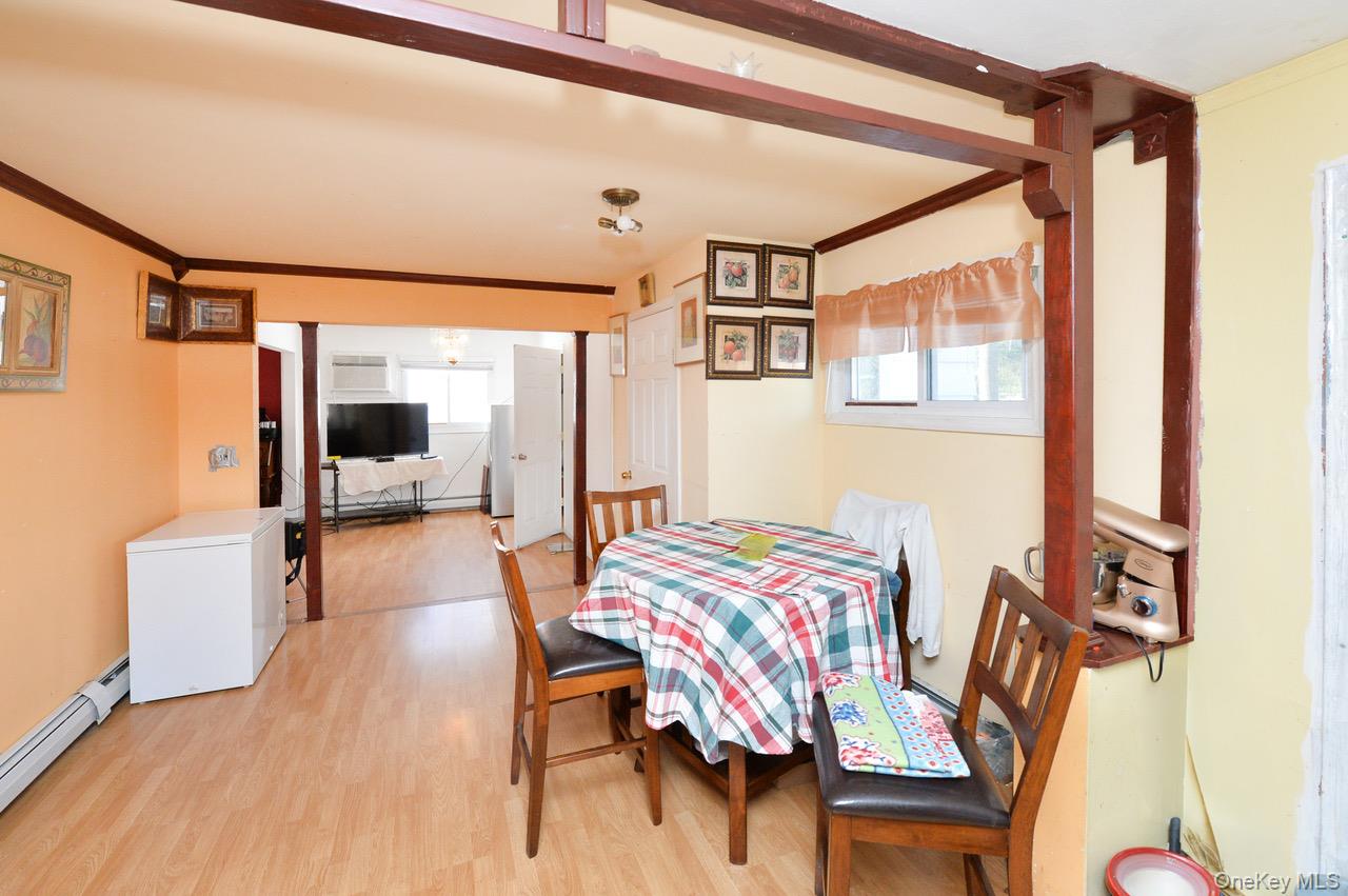 7 South Oak Street Spring Valley, NY 10977 - Photo 18 of 24 a bedroom with a bed and a chair