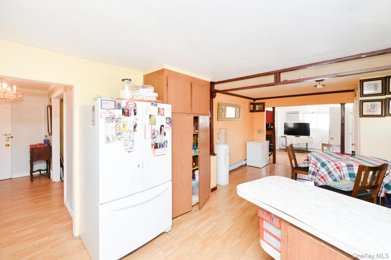 7 South Oak Street Spring Valley, NY 10977 - Photo 20 of 24 a kitchen with stainless steel appliances refrigerator stove and wooden floor