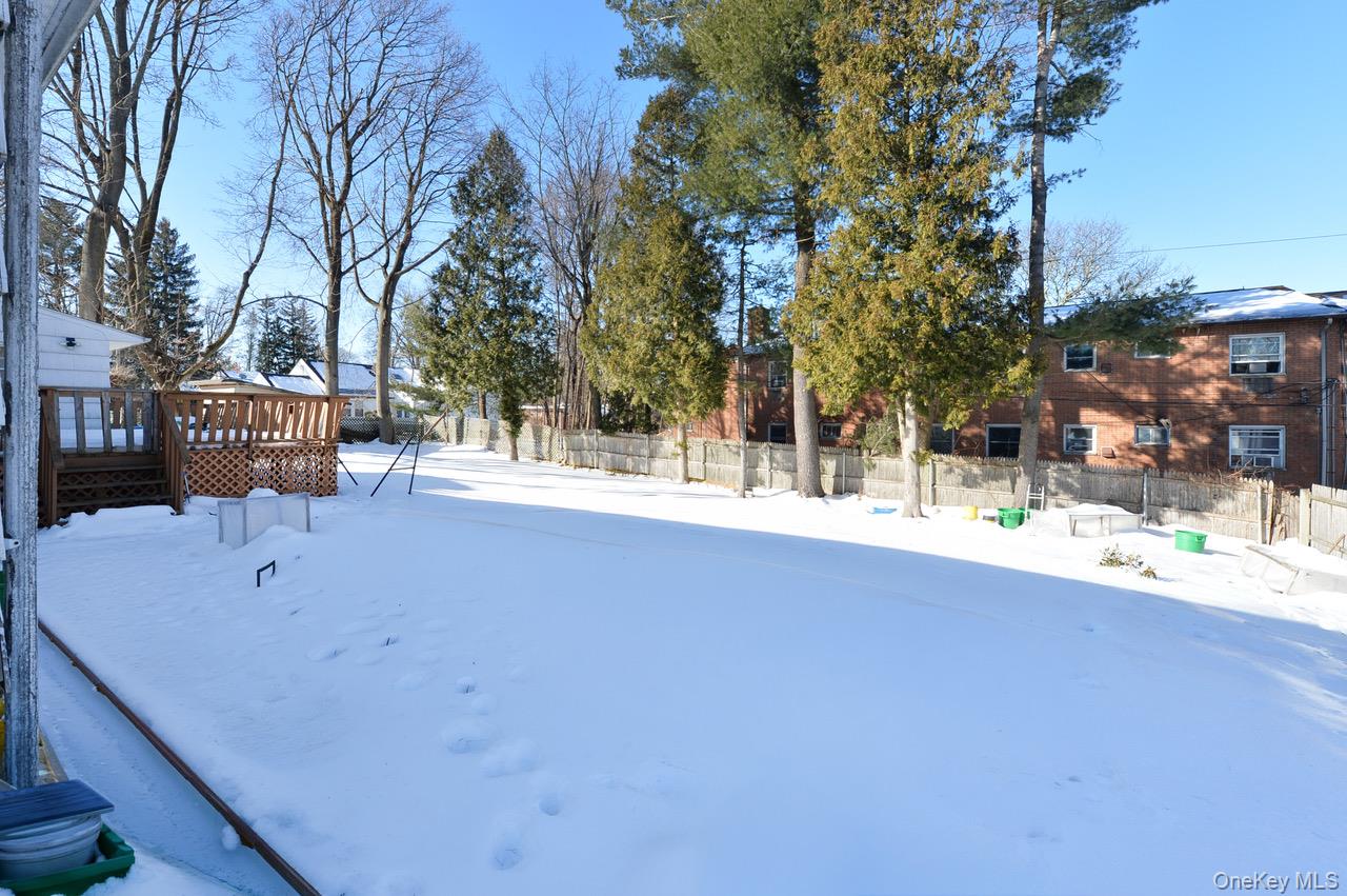 7 South Oak Street Spring Valley, NY 10977 - Photo 22 of 24 a view of swimming pool with a yard and trees