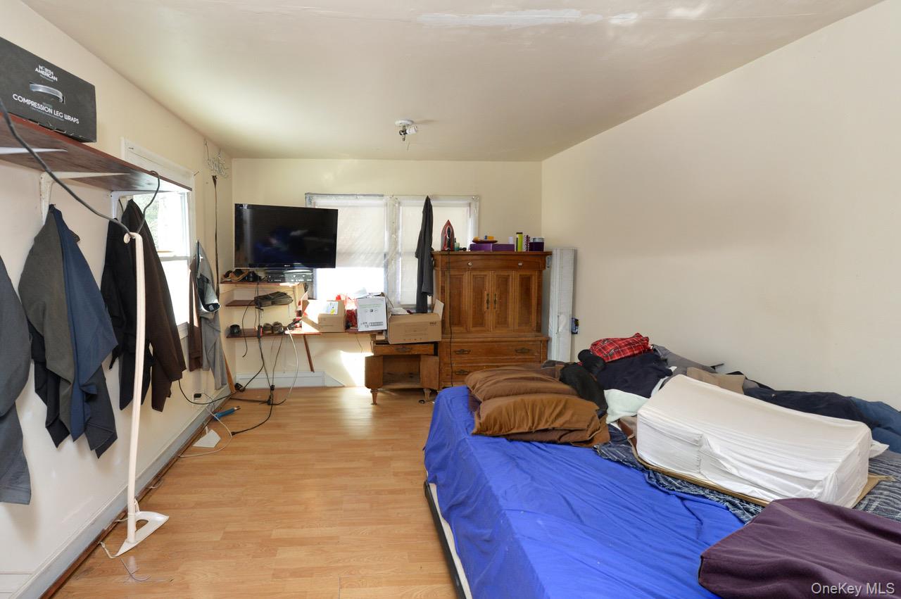 7 South Oak Street Spring Valley, NY 10977 - Photo 8 of 24 a living room with furniture and a flat screen tv