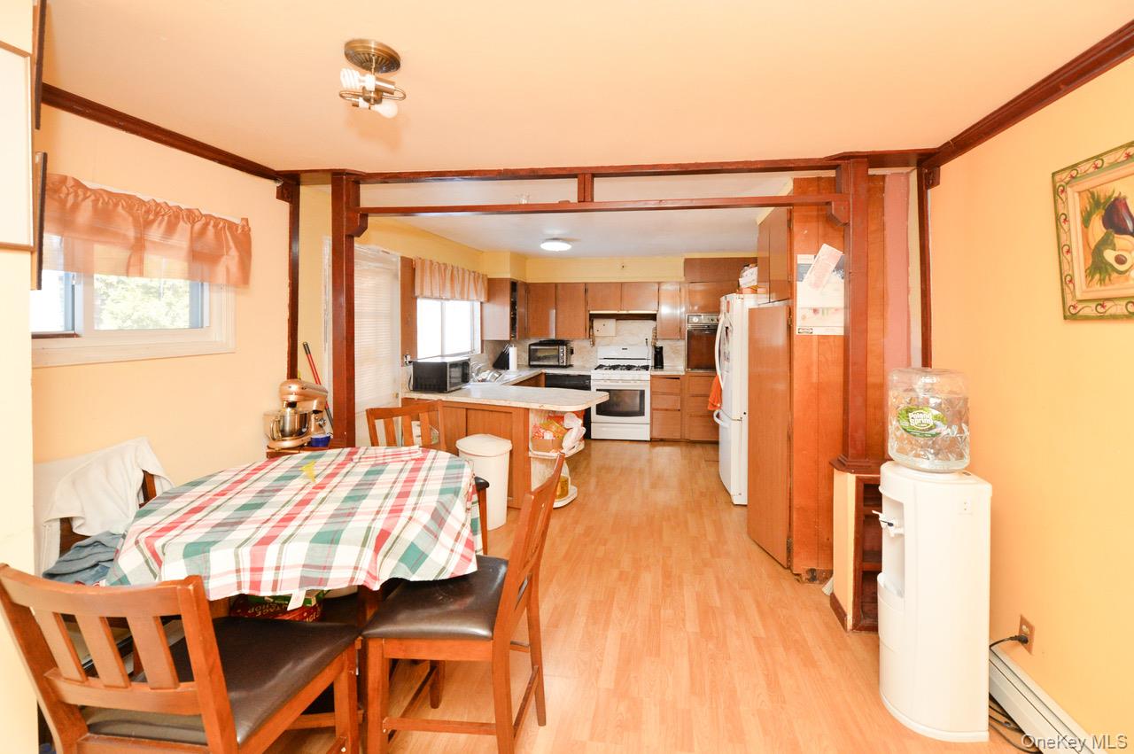 7 South Oak Street Spring Valley, NY 10977 - Photo 10 of 24 a bedroom with a bed and a view of living room