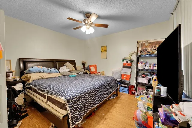 a bed room with a bed and a baby bed