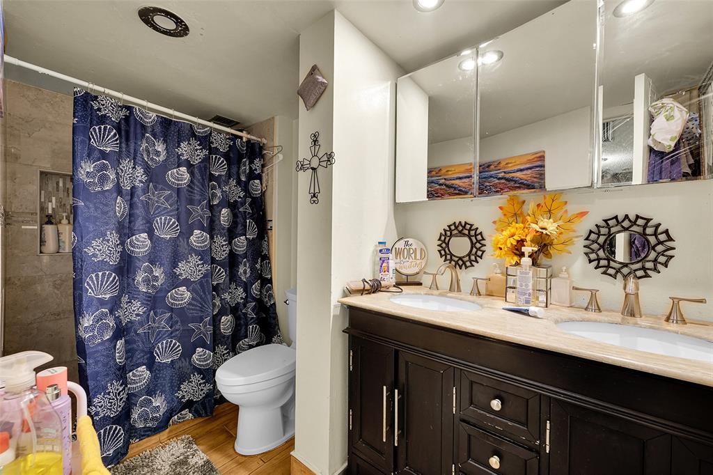 7041 Environ Boulevard, Unit 326 Lauderhill, FL 33319 - Photo 13 of 44 a bathroom with a sink toilet and shower