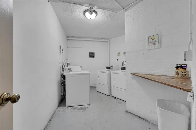a view of a storage & utility room with a sink
