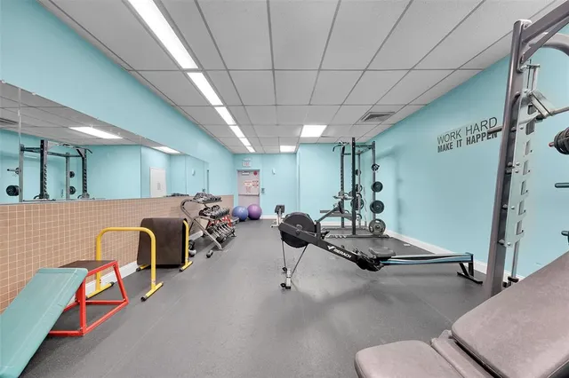 a room with gym equipment and a window