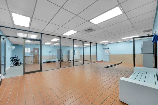 a view of an empty room with glass door