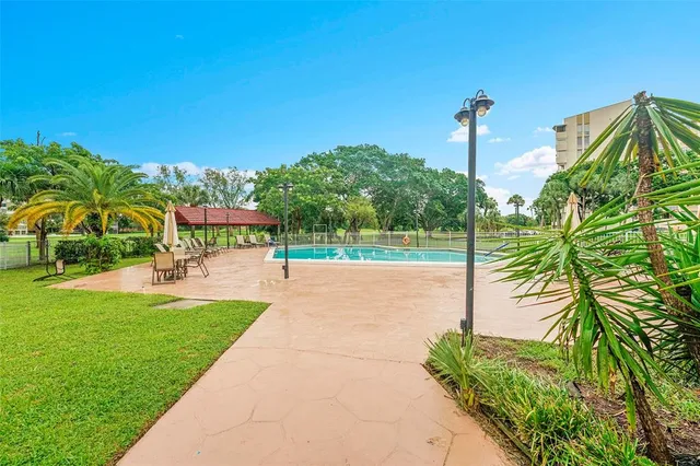 a view of a park with palm trees