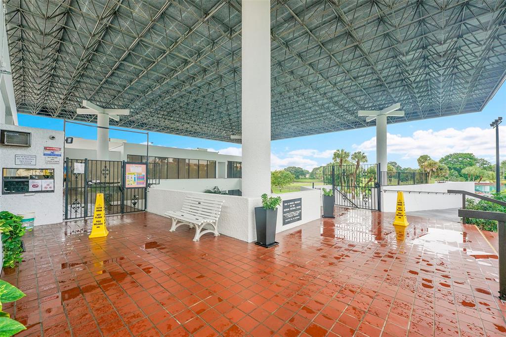 7041 Environ Boulevard, Unit 326 Lauderhill, FL 33319 - Photo 36 of 44 a view of a swimming pool with a patio