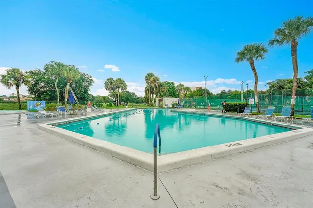 a view of a swimming pool with a lake view