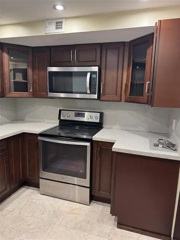 a view of room with window and wooden floor