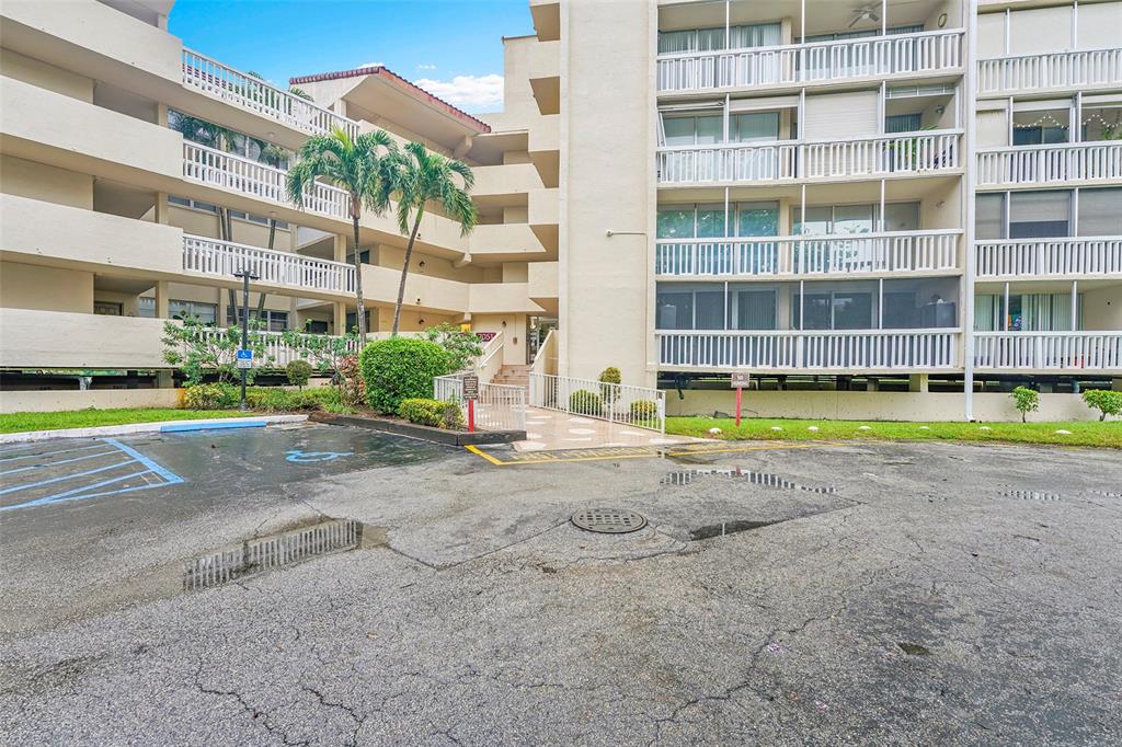 7041 Environ Boulevard, Unit 326 Lauderhill, FL 33319 - Photo 41 of 44 a view of a building with a swimming pool