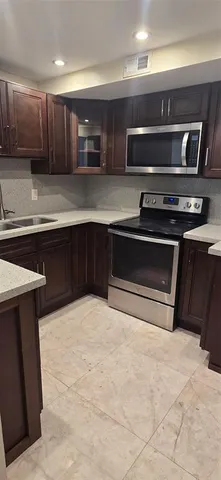 a bed room with a bed and a chandelier