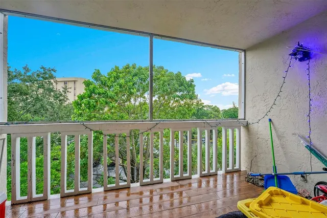 a view of a balcony with chairs