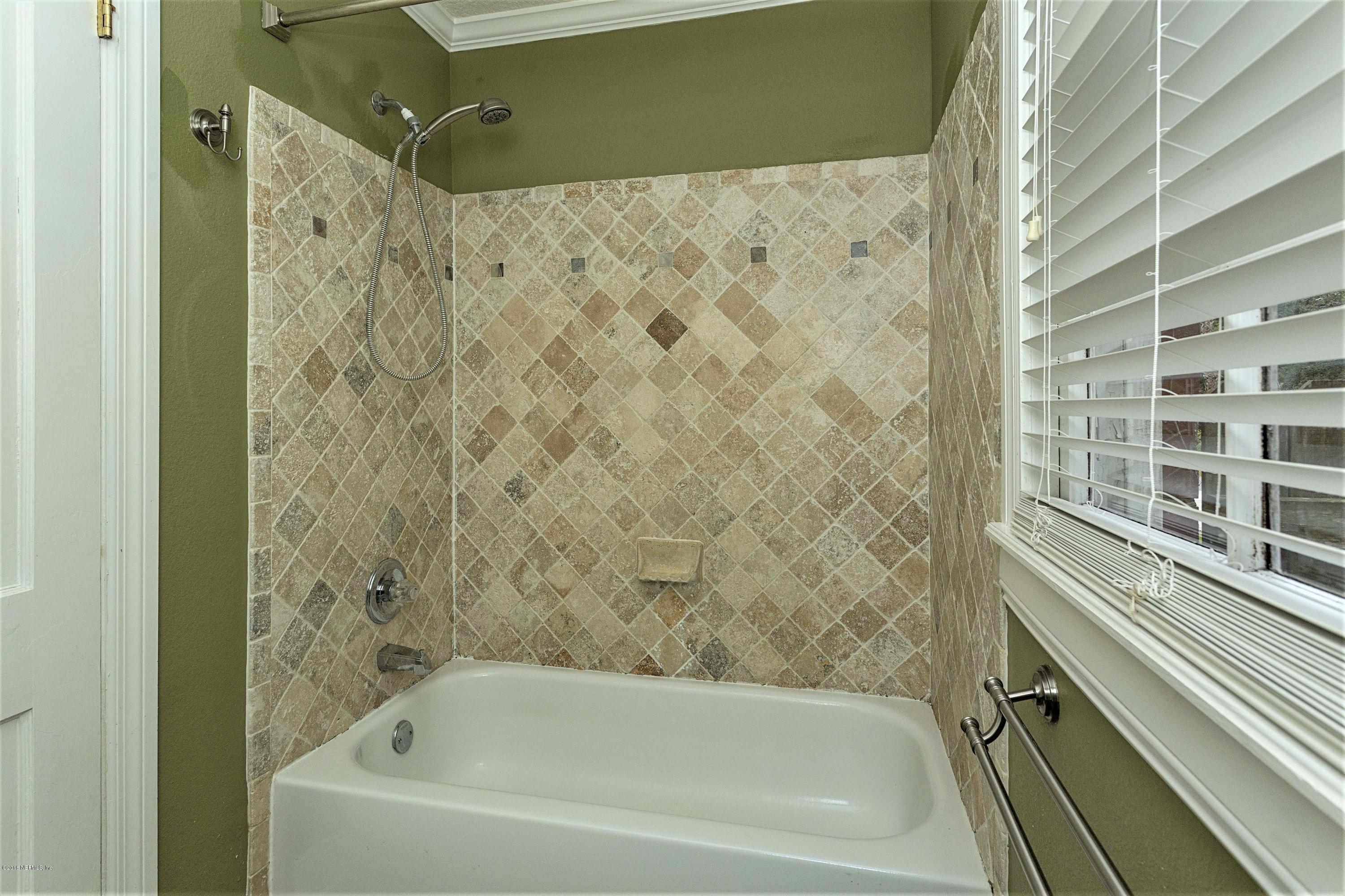2309 Somerset Road Jacksonville, FL 32210 - Photo 13 of 21 a bathroom with a bathtub