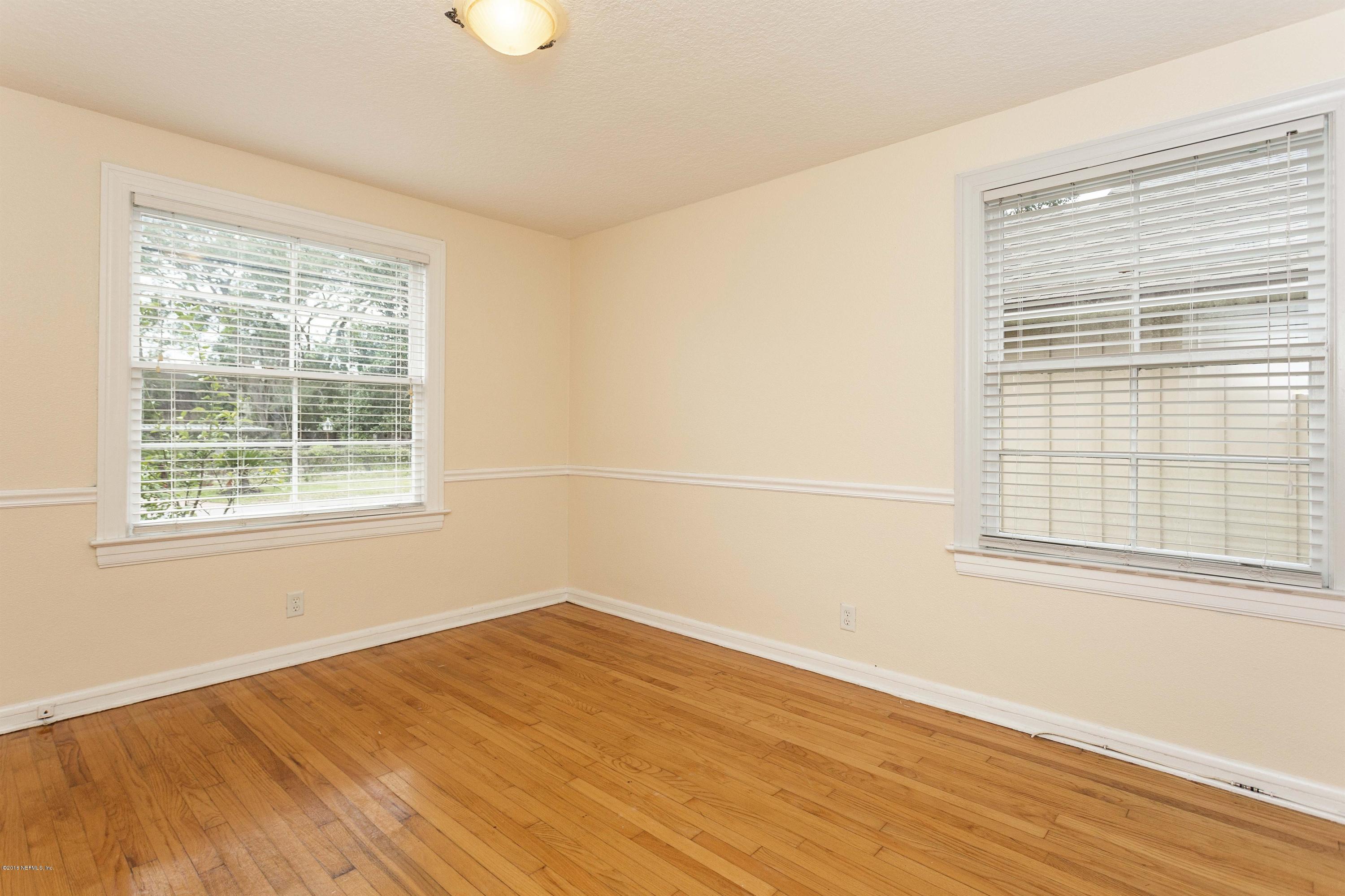 2309 Somerset Road Jacksonville, FL 32210 - Photo 14 of 21 a view of a room with wooden floor and a window