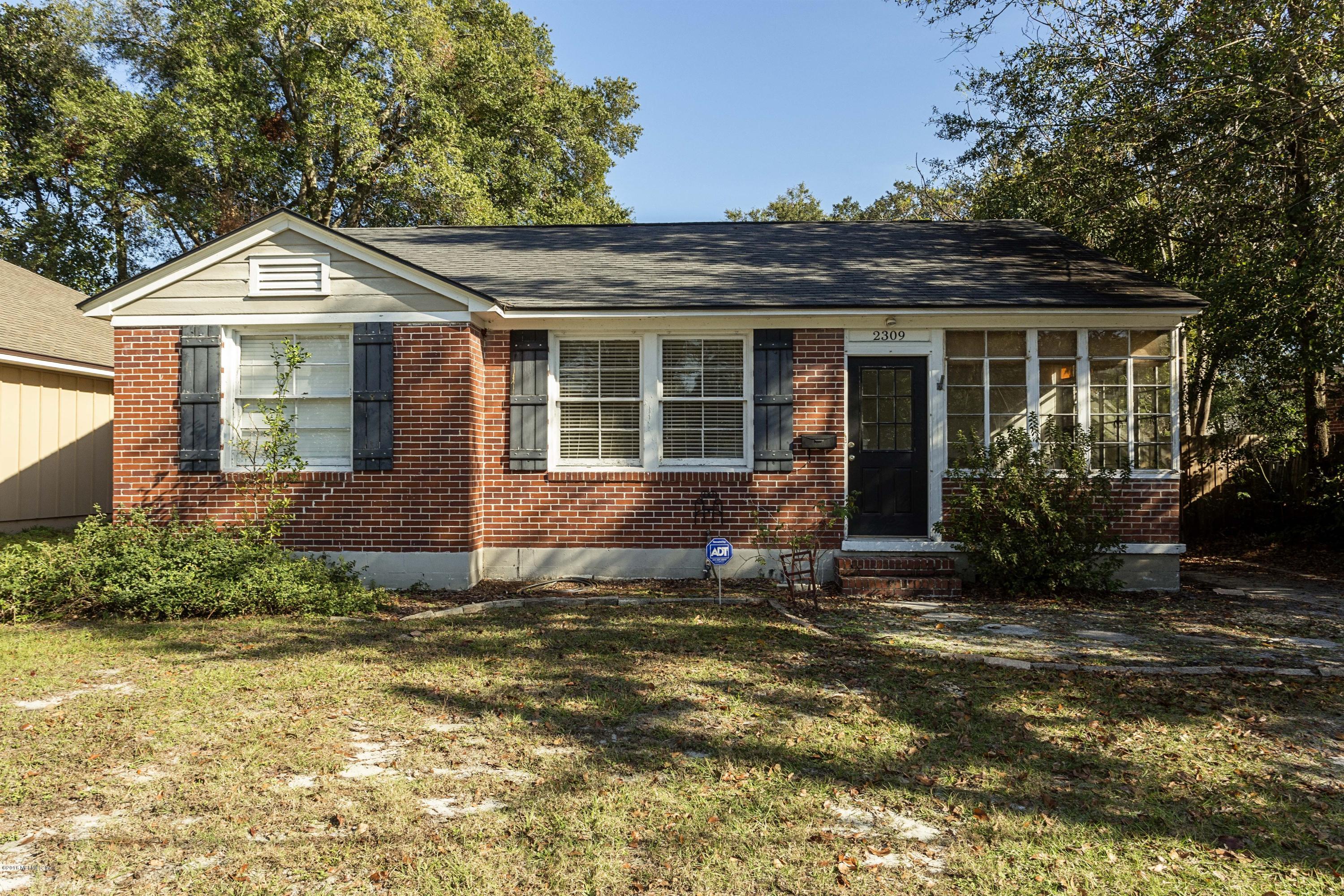 2309 Somerset Road Jacksonville, FL 32210 - Photo 21 of 21 a front view of a house with a yard