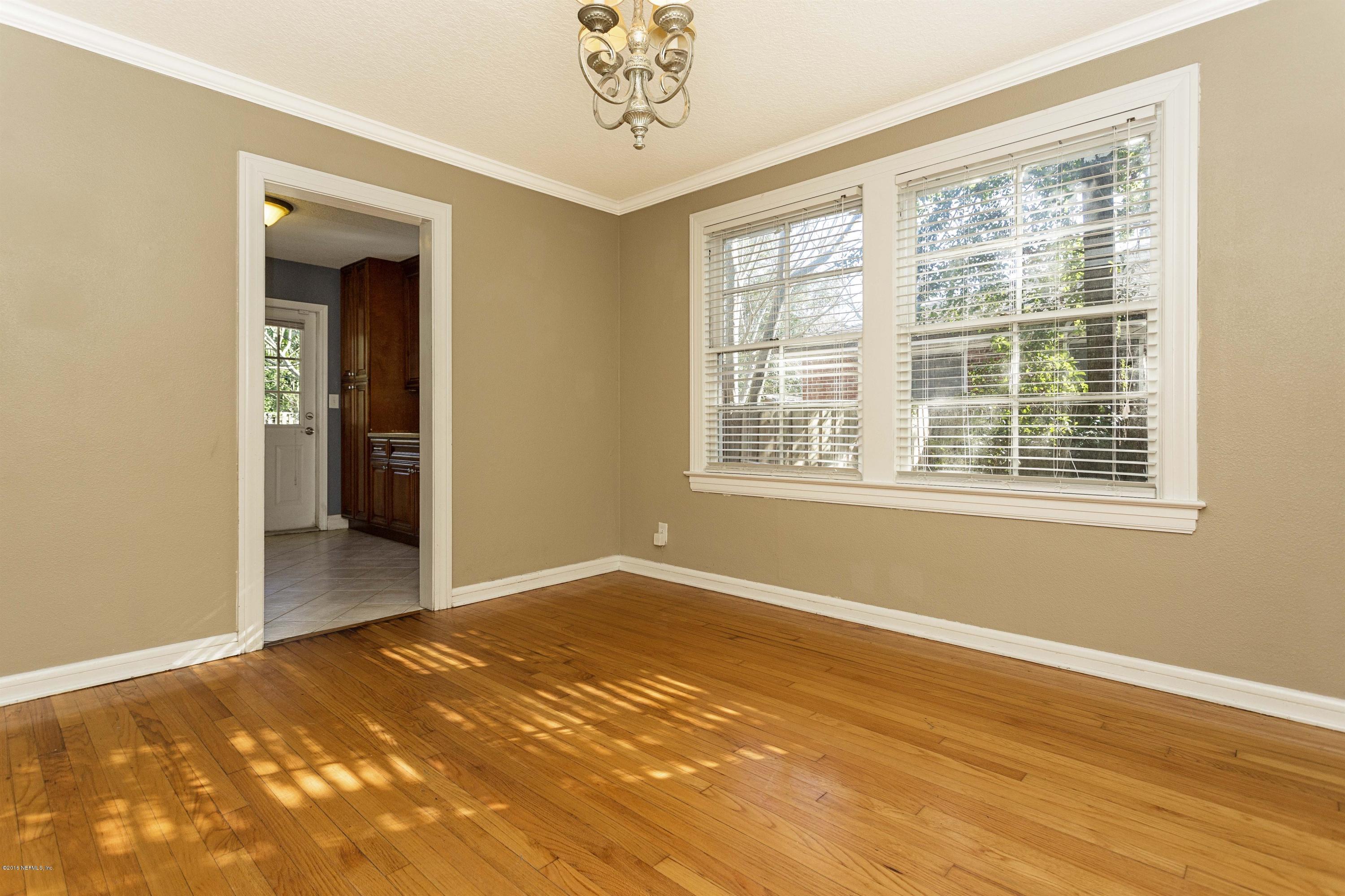 2309 Somerset Road Jacksonville, FL 32210 - Photo 7 of 21 a view of empty room with wooden floor and fan