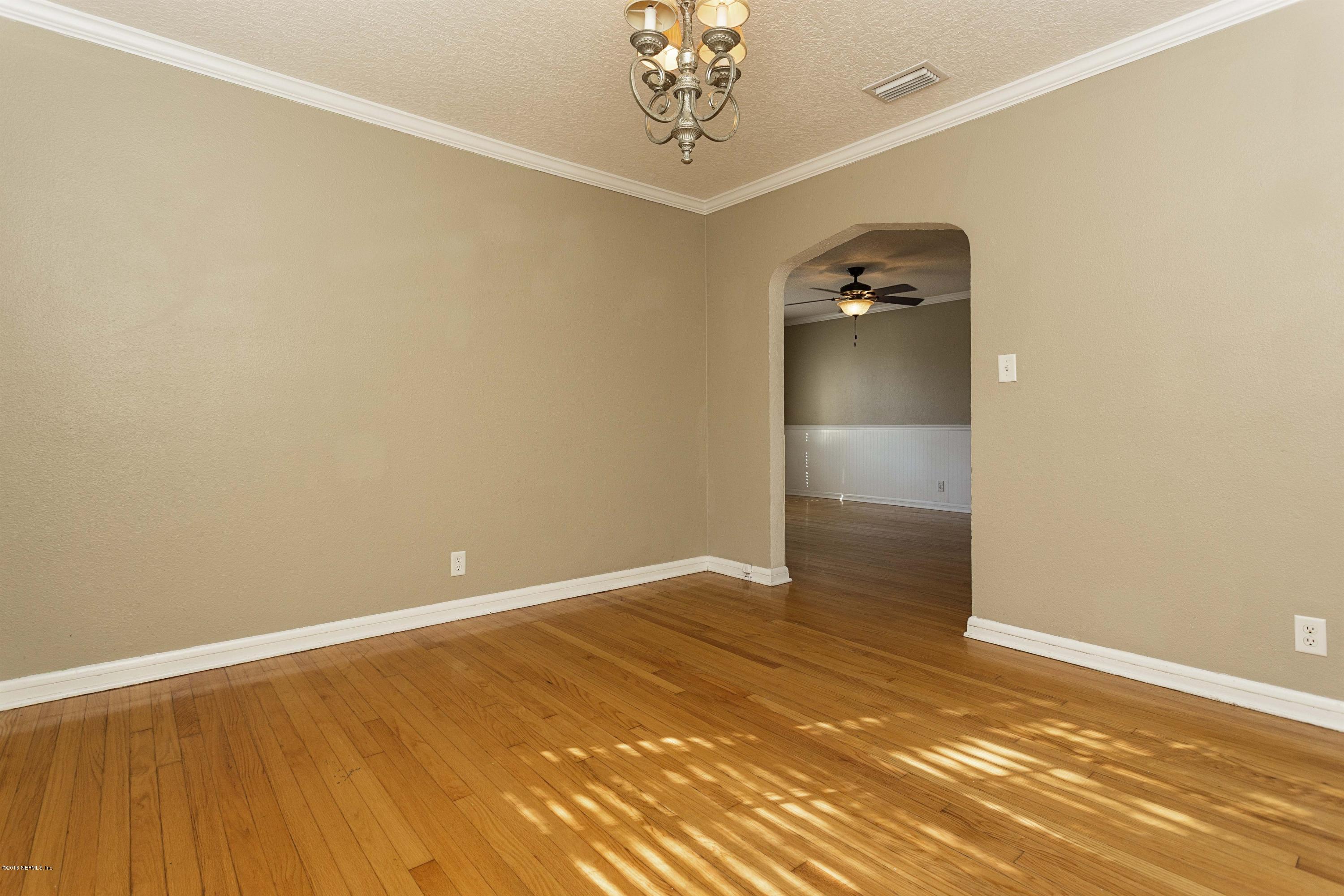 2309 Somerset Road Jacksonville, FL 32210 - Photo 8 of 21 wooden floor in an empty room