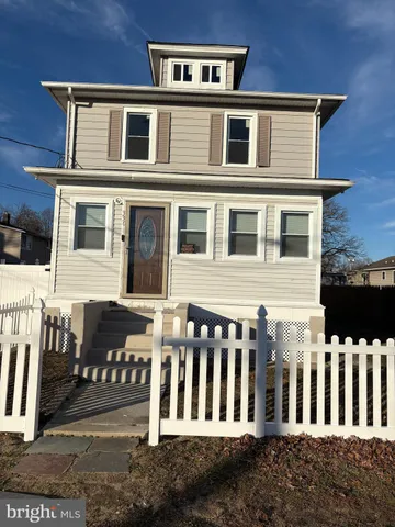 a front view of a brick house with many windows