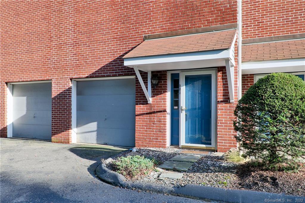 381 Unquowa Road, Unit 381 Fairfield, CT 06824 - Photo 1 of 1 Front door of the condo with a 2 car garage and storage.