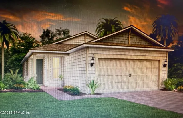 a view of a white house next to a yard with potted plants