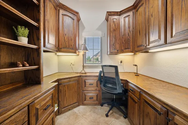 a kitchen with a sink cabinets and stainless steel appliances