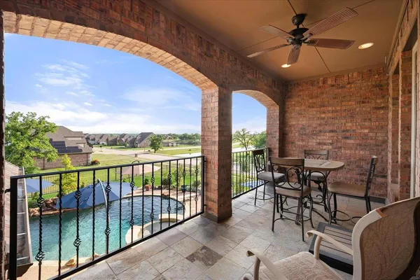 a view of a patio with a table and chairs
