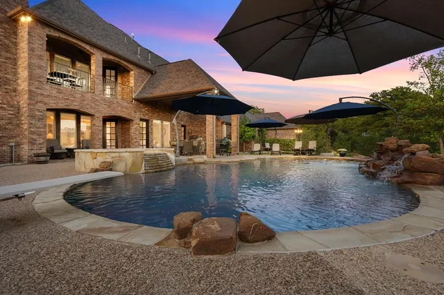 a view of a water pond with sitting area