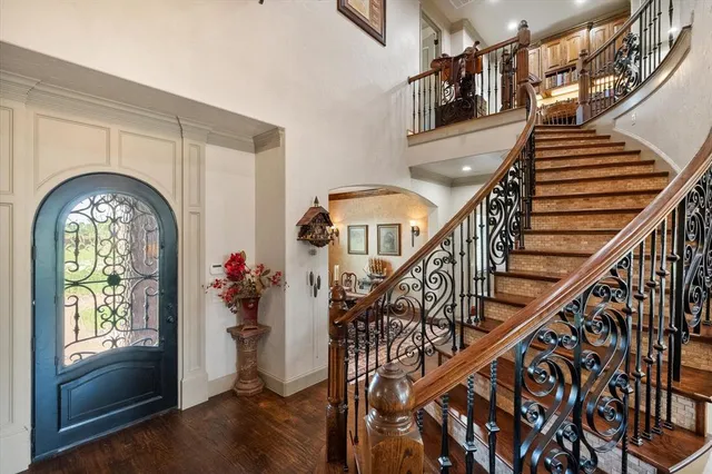 a view of entryway and hall with wooden floor