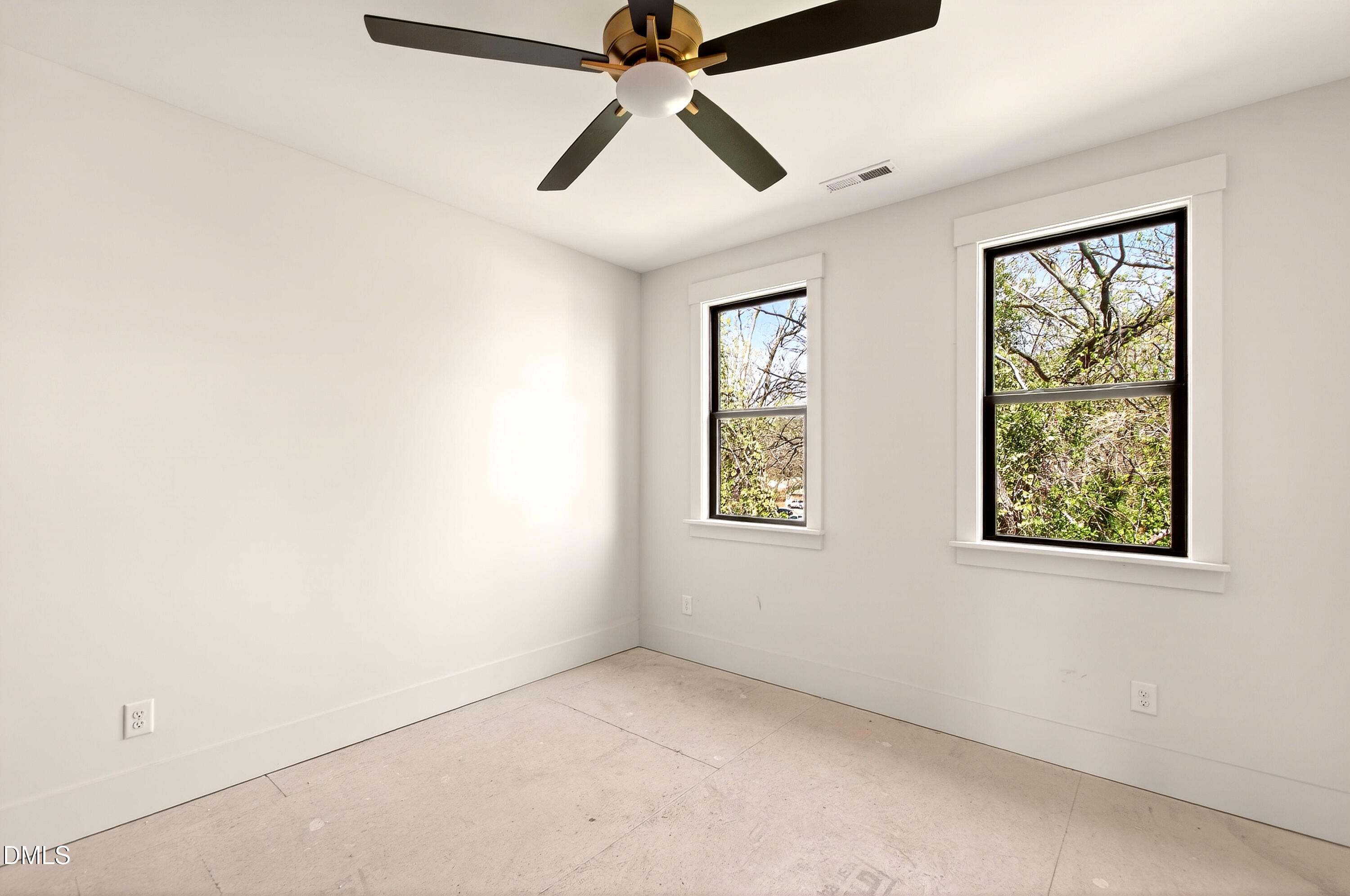 909 Oberlin Road Raleigh, NC 27605 - Photo 30 of 59 an empty room with windows and fan