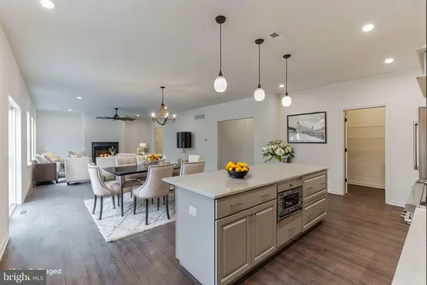 a view of kitchen with cabinets and wooden floor