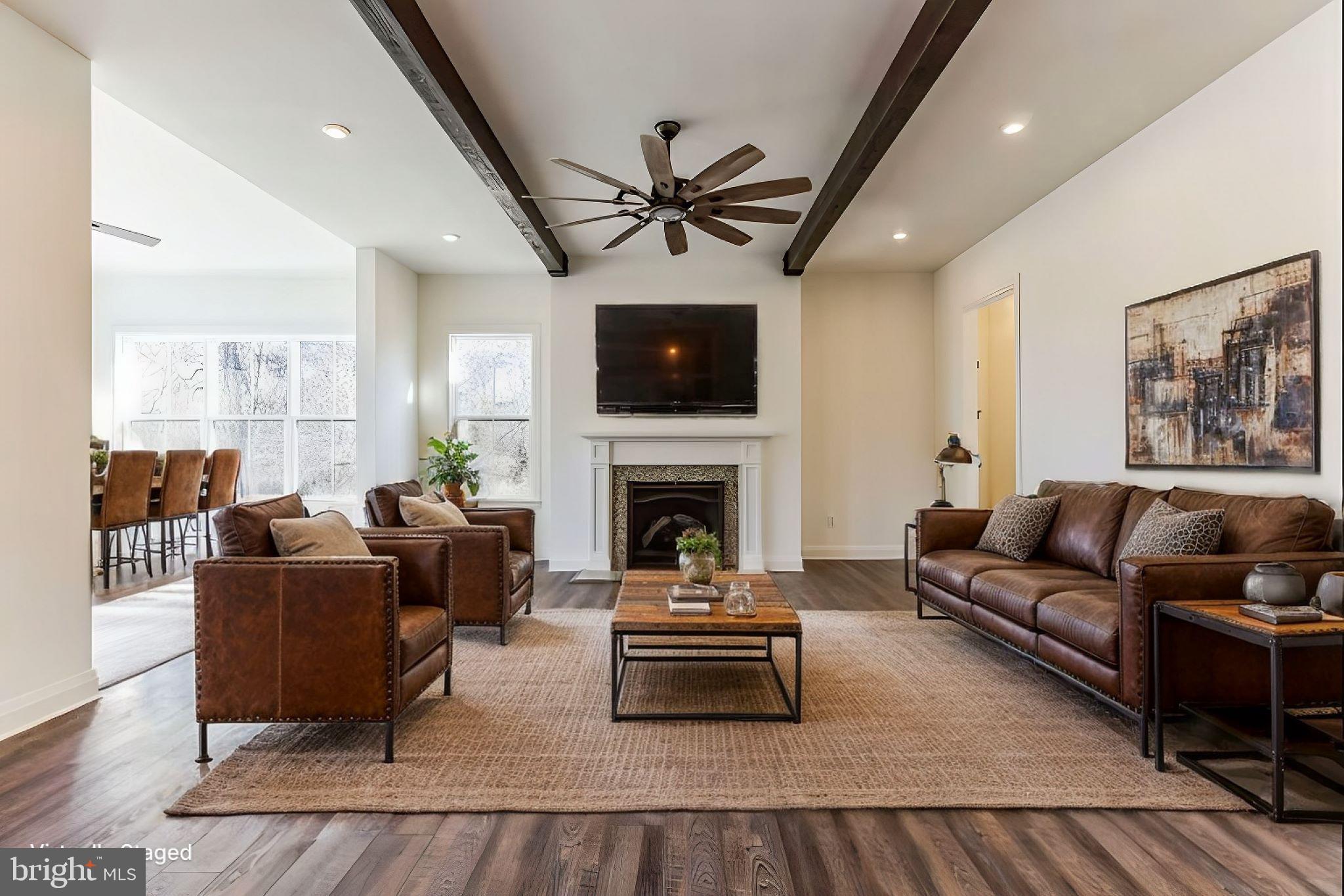 1487 Bunker Hill Road Middletown, DE 19709 - Photo 18 of 33 a living room with furniture a fireplace and a flat screen tv