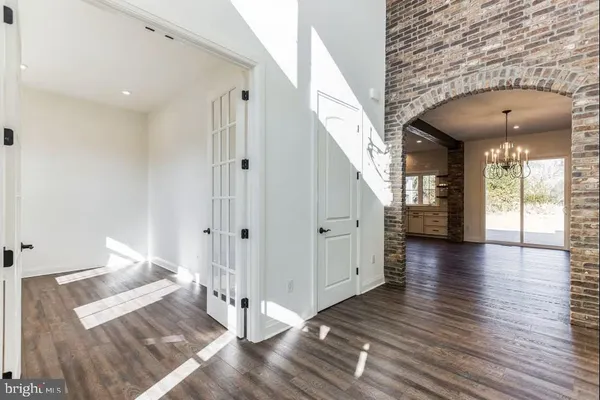 a view of livingroom with hardwood floor and hallway