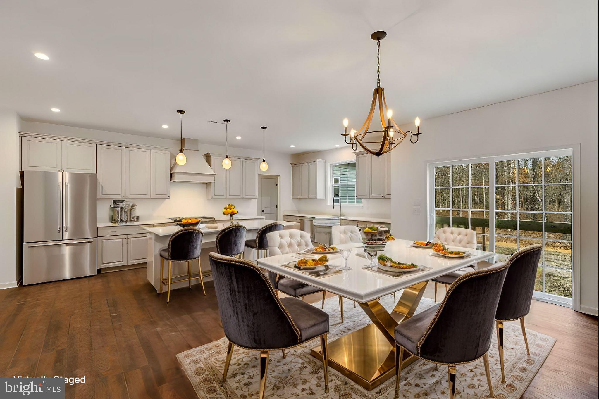 1487 Bunker Hill Road Middletown, DE 19709 - Photo 8 of 33 a dining room filled chandelier and wooden floor