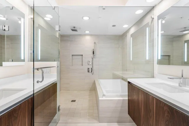 a bathroom with a bathtub and shower