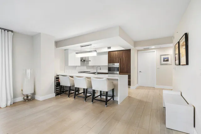 a kitchen with stainless steel appliances granite countertop a sink and cabinets