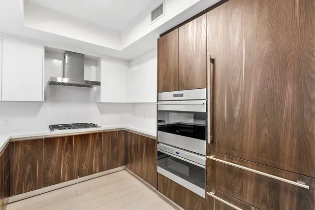 a kitchen with a table and chairs in it