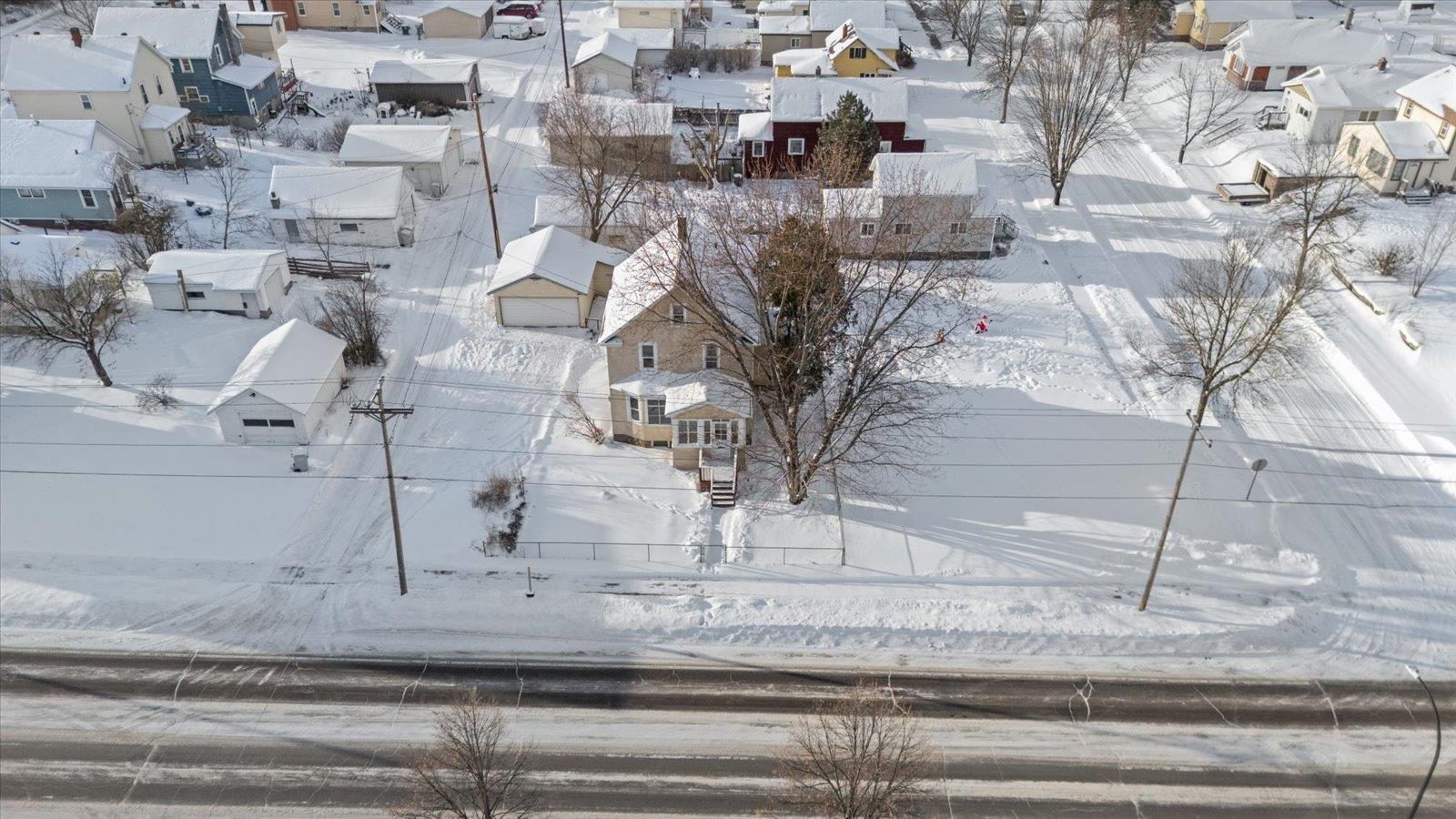 217 3rd Avenue Northwest Chisholm, MN 55719 - Photo 2 of 47 Snowy aerial view with a residential view