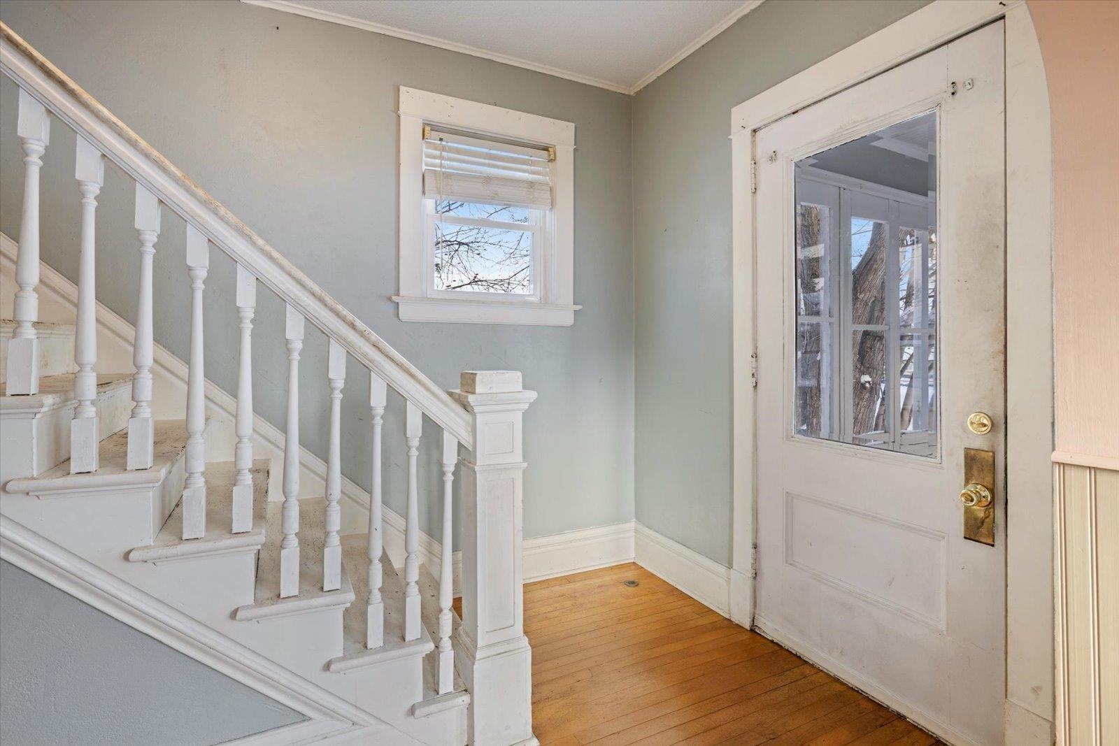 217 3rd Avenue Northwest Chisholm, MN 55719 - Photo 34 of 47 Entrance foyer featuring stairs, light wood-style floors, and ornamental molding