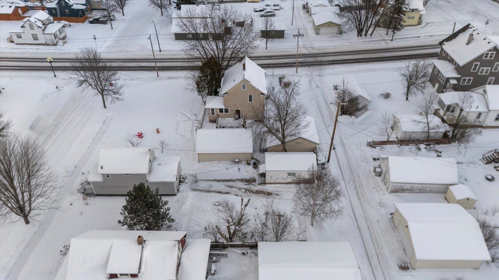 217 3rd Avenue Northwest Chisholm, MN 55719 - Photo 8 of 47 Snowy aerial view with a residential view