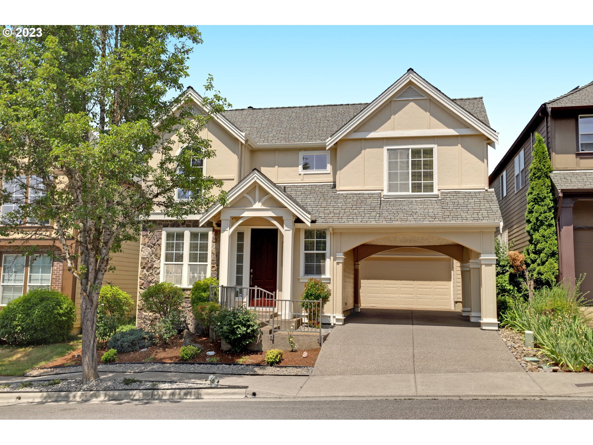 12799 Northwest Forest Spring Lane Portland, OR 97229 - Photo 1 of 30 a front view of a house with yard