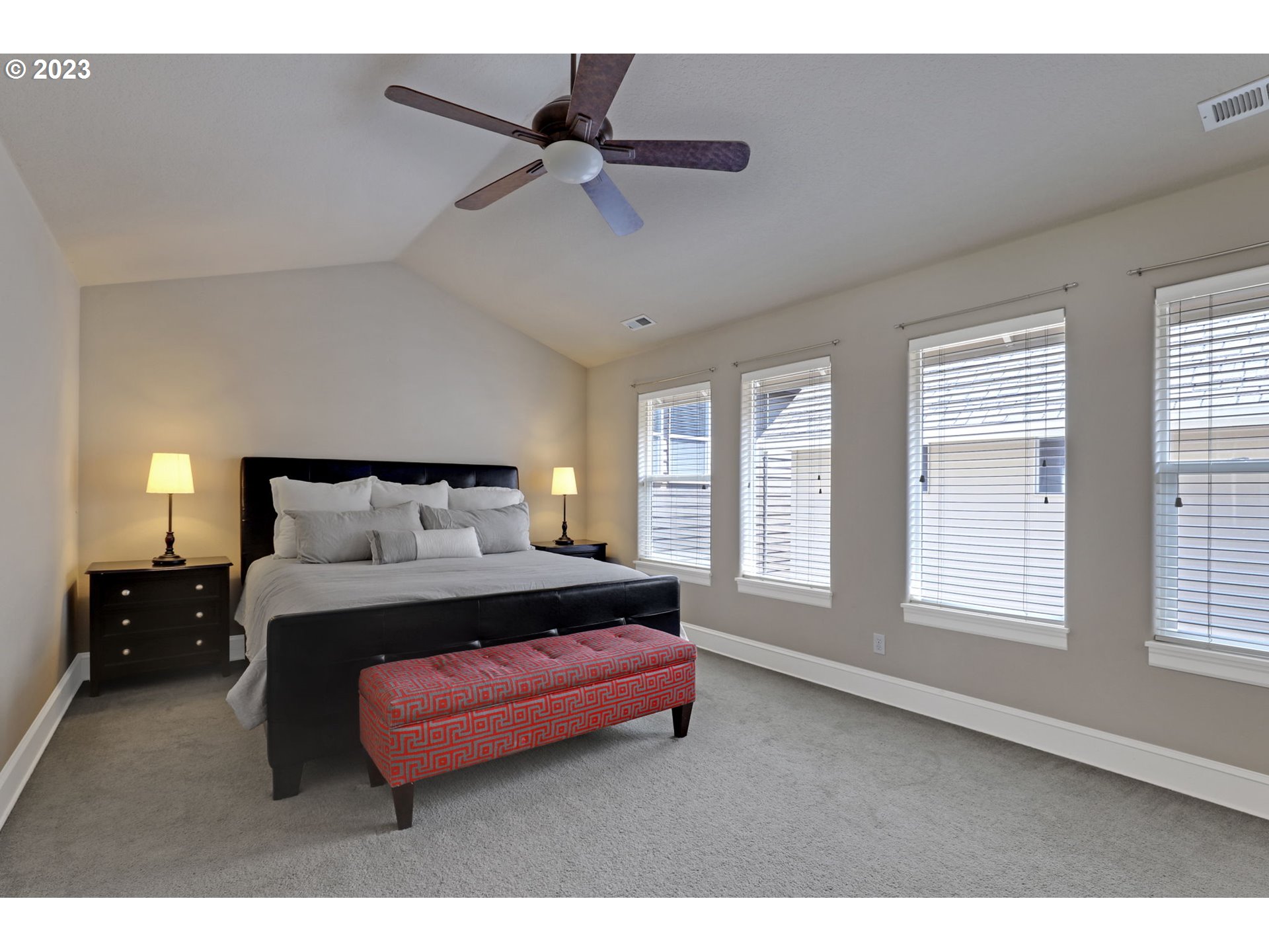 12799 Northwest Forest Spring Lane Portland, OR 97229 - Photo 15 of 30 a spacious bedroom with a bed a window and closet