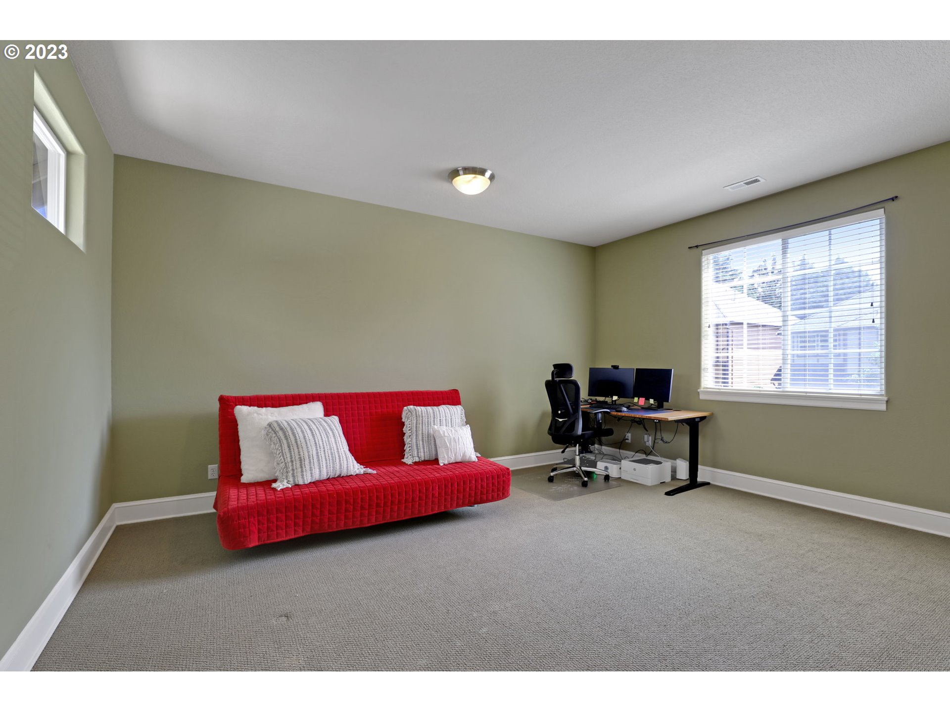 12799 Northwest Forest Spring Lane Portland, OR 97229 - Photo 19 of 30 a living room with furniture and a window