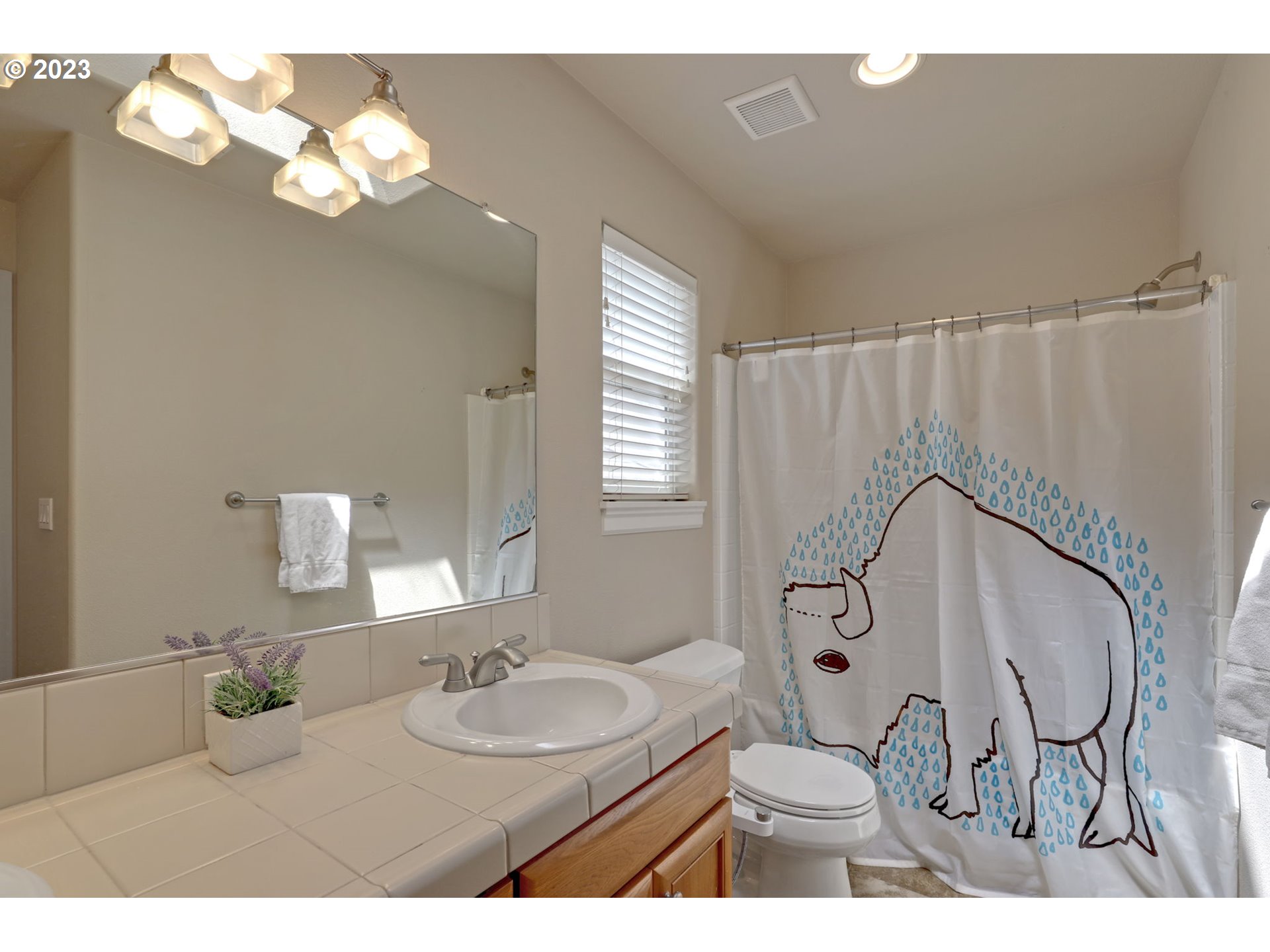 12799 Northwest Forest Spring Lane Portland, OR 97229 - Photo 24 of 30 a bathroom with a sink vanity granite and a mirror