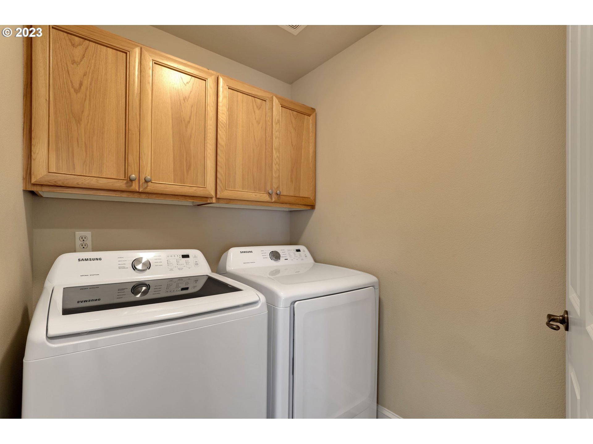 12799 Northwest Forest Spring Lane Portland, OR 97229 - Photo 25 of 30 a utility room with dryer and washer