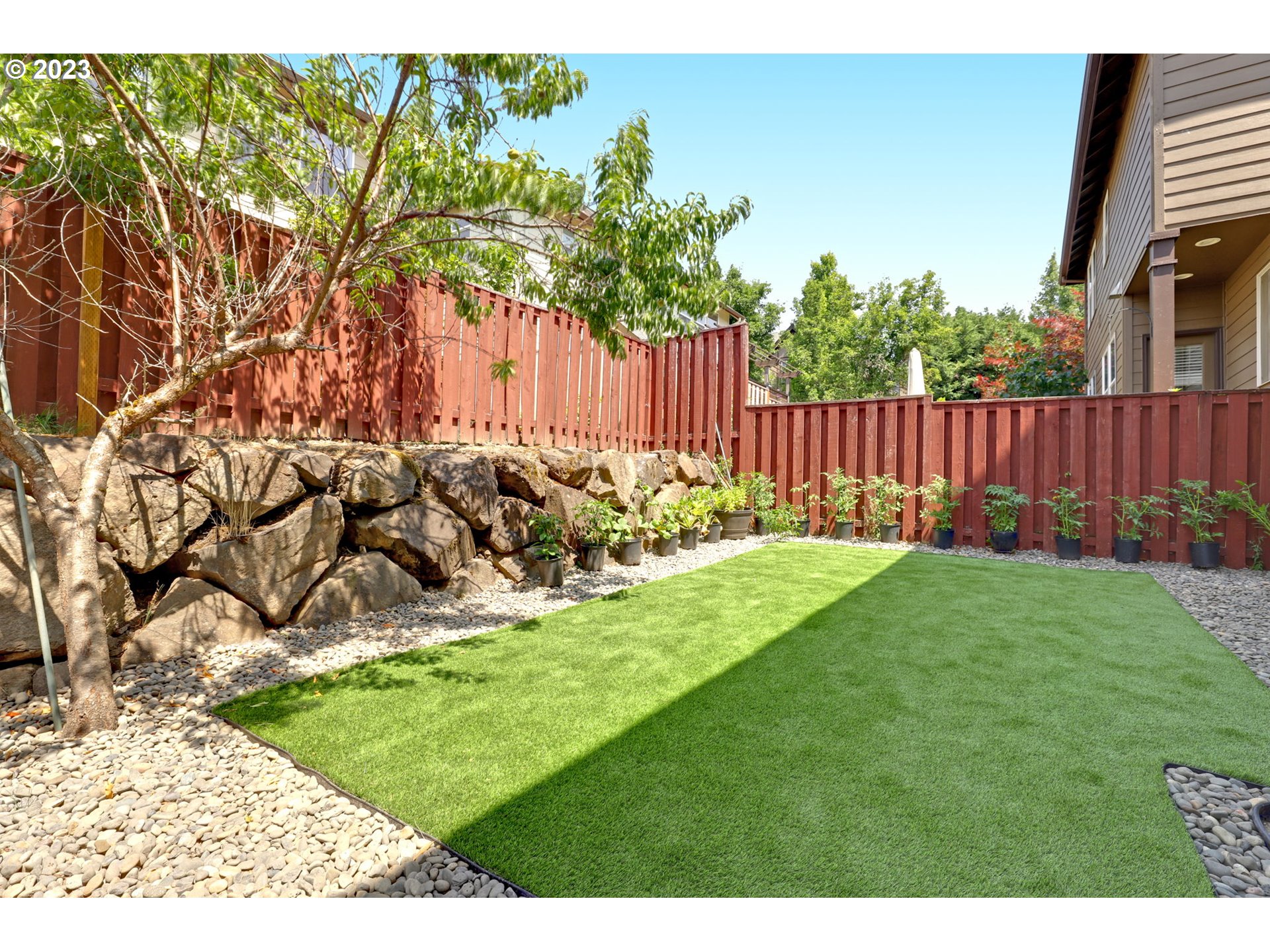 12799 Northwest Forest Spring Lane Portland, OR 97229 - Photo 29 of 30 a view of backyard with wooden fence