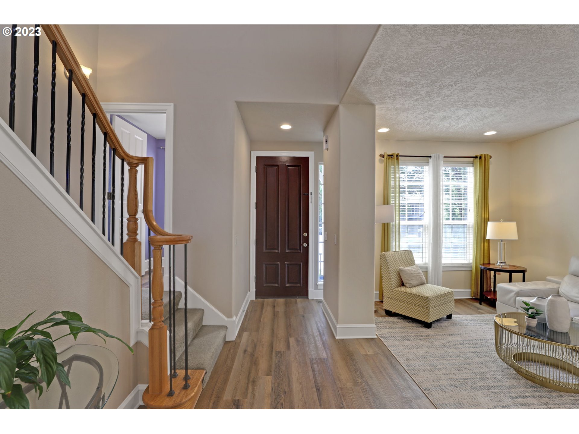 12799 Northwest Forest Spring Lane Portland, OR 97229 - Photo 3 of 30 a living room with furniture and a hard wood floor