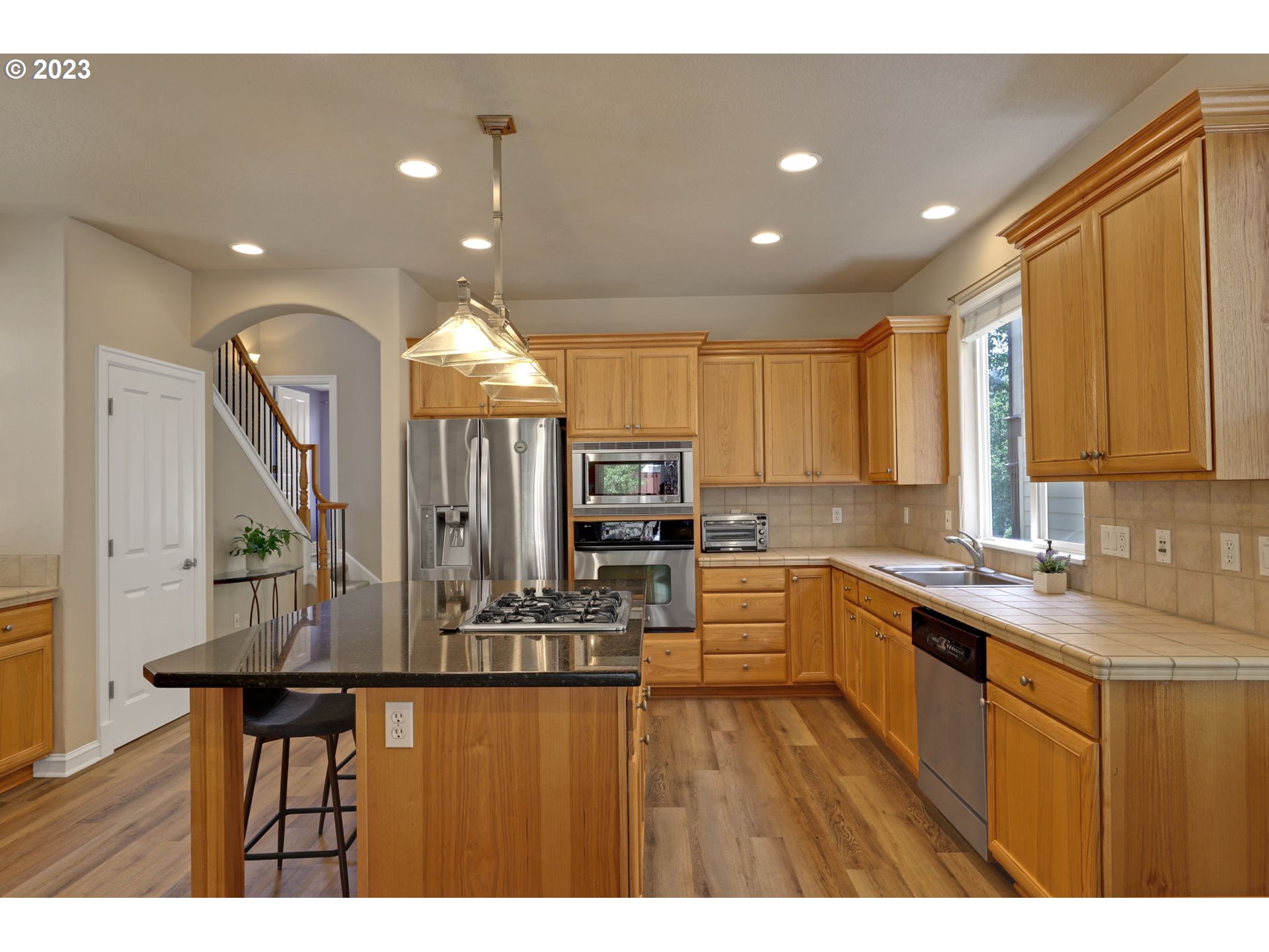 12799 Northwest Forest Spring Lane Portland, OR 97229 - Photo 8 of 30 a kitchen with sink and microwave