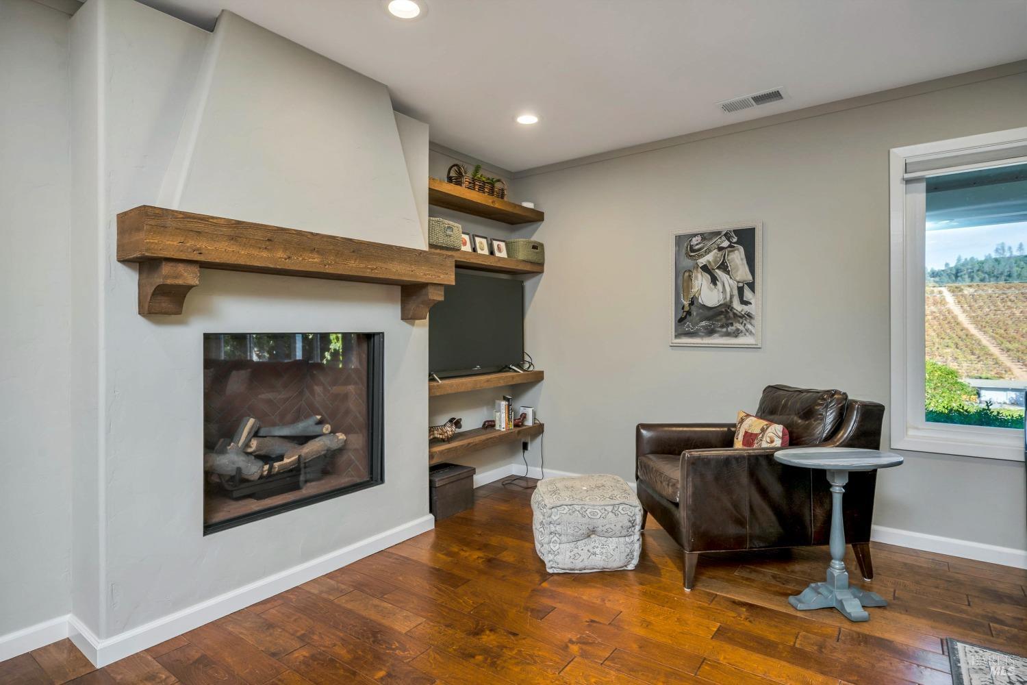 1389 Canyon Road Geyserville, CA 95441 - Photo 11 of 48 a living room with furniture and a fireplace