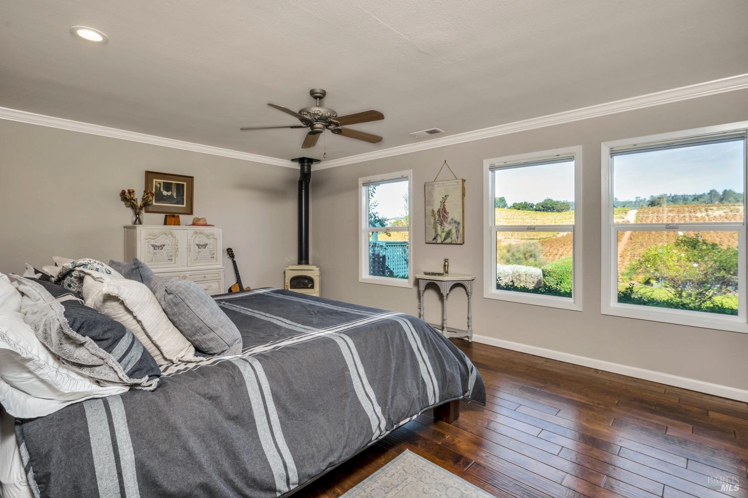 1389 Canyon Road Geyserville, CA 95441 - Photo 17 of 48 a bedroom with a bed and a large window